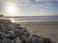 this is an image of a person riding a surfboard on a beach near the ocean