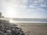 this is an image of a person riding a surfboard on a beach near the ocean