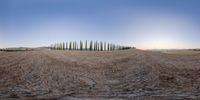 an image of a surreal looking photograph of a landscape at dusk with a fence on the left