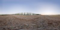 an image of a surreal looking photograph of a landscape at dusk with a fence on the left