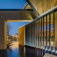 a view of a walkway, patio, and entrance to the art museum that is on a sloping hillside