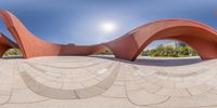 a picture taken looking through the lens at an artistic sculpture that appears to have been designed for a fish eye view