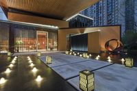 lanterns lit up on the steps outside an office building at night with modern lighting and modern architecture