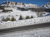 Swiss Alps: A Winding Road through Snowy Landscape