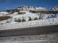 Swiss Alps: A Winding Road through Snowy Landscape