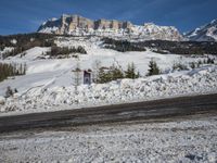 Swiss Alps: A Winding Road through Snowy Landscape