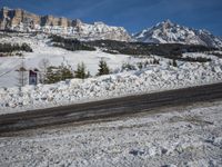 Swiss Alps: A Winding Road through Snowy Landscape