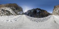 a couple of snow covered dirt roads in the mountains together from the bottom with snow