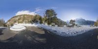 a 360 view of the winter landscape from above the mountains with lots of snow and trees