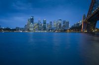 the city skyline is shown at night as seen from across the water in this undrempiched photo