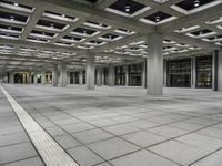 Symmetrical Interior Design in a Hall with Glass Ceiling