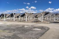 a row of solar panels on the ground of a solar park in the desert setting