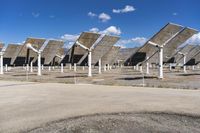 a row of solar panels on the ground of a solar park in the desert setting