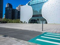 a person on a skateboard in front of a building that has a green apple shaped design