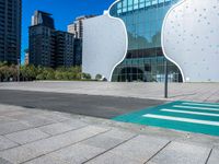 a person on a skateboard in front of a building that has a green apple shaped design