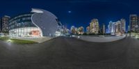 this photo shows what a fish shaped building is going up to see the city at night