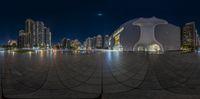 there is an empty city square with buildings in the background, as seen through the large fish eye lens