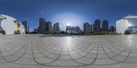 a view from inside of a big sphere with the sun in the background and buildings all around