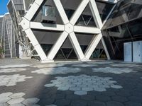 the building is shaped like hexagons with geometric designs on them as if they were carved into stone