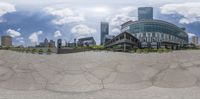 the image shows a fisheye view of a business district in a modern city from the front