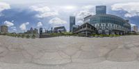 the image shows a fisheye view of a business district in a modern city from the front