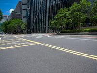 a road with lines and yellow painted on the sides of it in a city park