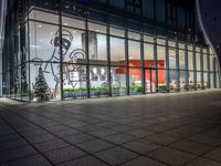 an empty building with glass windows, with christmas decorations in the front and outside it