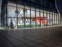 an empty building with glass windows, with christmas decorations in the front and outside it