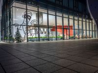 an empty building with glass windows, with christmas decorations in the front and outside it