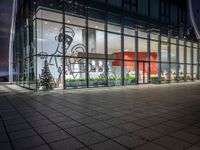 an empty building with glass windows, with christmas decorations in the front and outside it