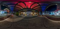 3d view of city plaza with buildings at night time, with blue and red lighting