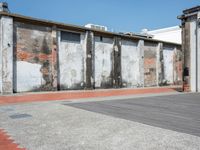 two walls side by side with red brick and cement on them to show the different colors and textures