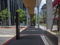 a car on a city street with cars parked behind it and a building next to the sidewalk