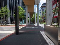 a car on a city street with cars parked behind it and a building next to the sidewalk