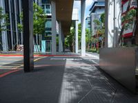 a car on a city street with cars parked behind it and a building next to the sidewalk