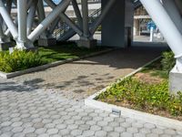 a walkway on an overpass in the city with a sign underneath it for pedestrians to see