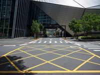 a road in front of a modern building with a few trees on it at the sides of the road