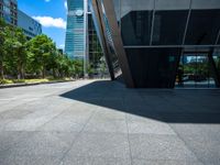 two tall buildings are in the background in this view of another building in the foreground