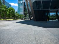 two tall buildings are in the background in this view of another building in the foreground