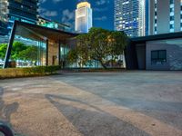 a view of cityscape with the tall buildings reflecting it in the water front