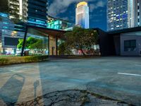 a view of cityscape with the tall buildings reflecting it in the water front