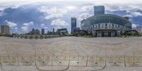 a city and the building seen through a fisheye lens lens while you can see the reflection