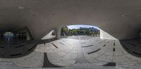 this is an image of the view of the circular structure of an outdoor area with stairs and benches