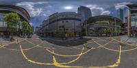 a panoramic view of the city street taken in a fisheye mirror with a sky background