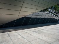 a building with silver and black architecture is seen in this photograph, which appears to be very modern