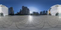 a view from within an spherical lens looking toward the skyline of a city with a large building