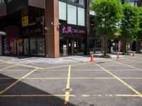 a corner store is shown with traffic cones in front of it on the street side