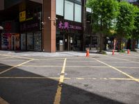 a corner store is shown with traffic cones in front of it on the street side