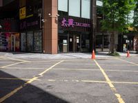 a corner store is shown with traffic cones in front of it on the street side