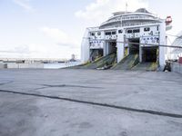 the boat is docked at the pier ready for the next passengers to board it,